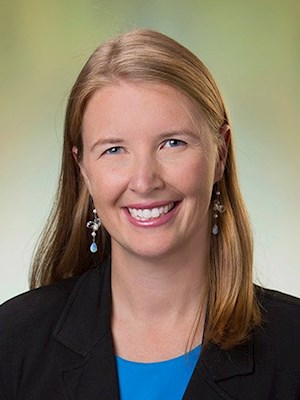catherine-benziger Catherine Benziger, MD, cardiologist at Essentia Health - Spooner Clinic, smiling with a professional appearance in a black blazer and blue top.