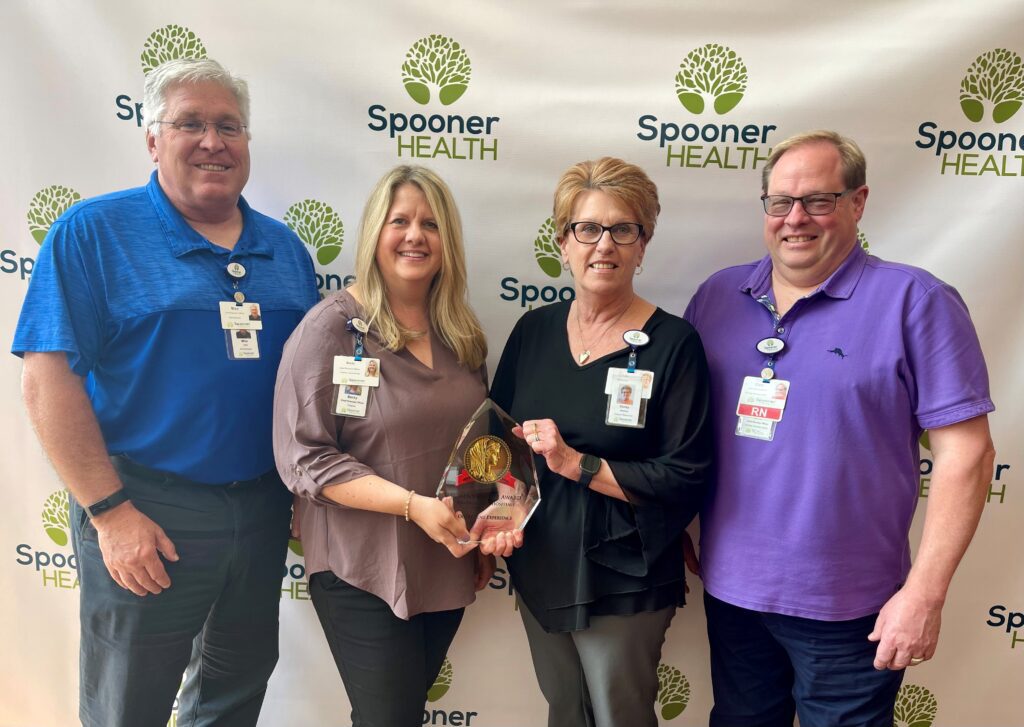 Photo of Spooner Health with Women's Choice Award; Pictured left to right: Mike Schafer, Rebecca Busch, Cindy Rouzer, Clint Miller